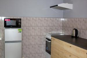 Kuchnia lub aneks kuchenny w obiekcie Szkocka 4 Apartamenty