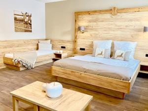 Voodi või voodid majutusasutuse Hotel Sonnenhof Aspach toas