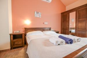 a bedroom with two white towels on a bed at Villa Plasa Krk in Kras +34 photos