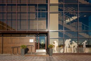 a building with statues in front of it at Voyage Business Hotel in Saint Petersburg