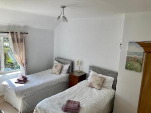 Ένα ή περισσότερα κρεβάτια σε δωμάτιο στο Glenbrae House 3 bedrooms near Nantwich with countryside views on private driveway