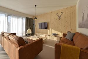 Televízia a/alebo spoločenská miestnosť v ubytovaní Element Lakeside Apartments