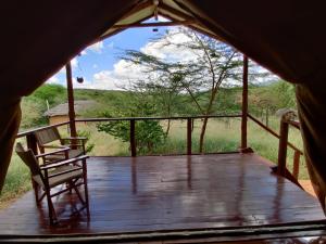 desde el interior de una tienda de campaña con terraza de madera en Oldonyo Orok Lodge, en Kajiado