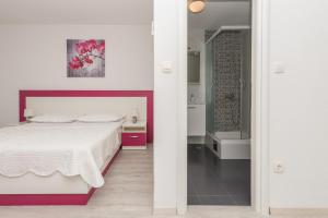 Postel nebo postele na pokoji v ubytování Apartmani Katarina