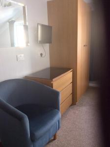 A television and/or entertainment center at Blantyre Guest House 