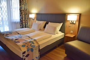 Postel nebo postele na pokoji v ubytování Cafe-Hotel Altreuter