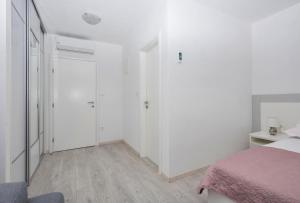 Postel nebo postele na pokoji v ubytování Apartmani Katarina