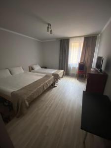 Postel nebo postele na pokoji v ubytování Готельно-ресторанний комлекс "Уклин" + 6 fotografií
