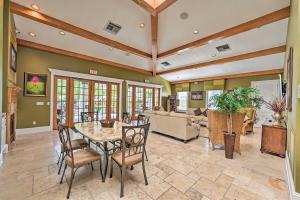 a large living room with a table and chairs at Luxury Golf Villa in Beautiful Lely Resort with Pool in Naples