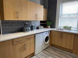 Kuchyň nebo kuchyňský kout v ubytování Bridge street apartment