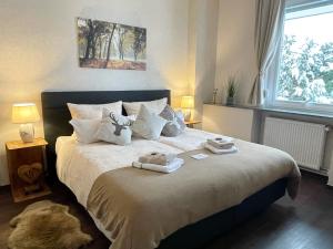 Un pat sau paturi într-o cameră la Hotel Wappenhof