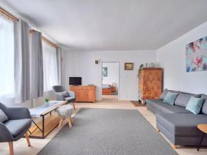 a living room with a couch and a table at Nemo Mielenko in Mielenko