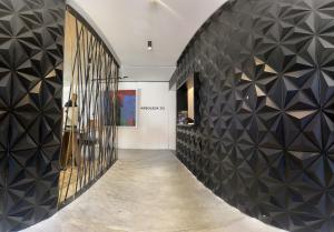 a hallway with black and white tile walls and a hallway with at Suites Arboleda 215 in Mexico City