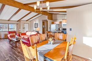 a dining room and living room with a table at Downtown Harrison Lakefront Getaway in Harrison