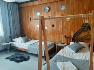 Postel nebo postele na pokoji v ubytování Hotel Olimpijski