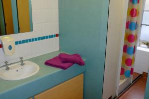 a bathroom with a sink and a mirror at Bath YMCA Hostel in Bath