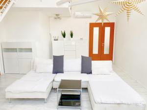 Ένα ή περισσότερα κρεβάτια σε δωμάτιο στο Loft with Rooftop and Free parking in Garage