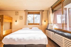 Voodi või voodid majutusasutuse Hotel Les Lutins toas