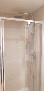a shower with a glass door in a bathroom at Lovely 2 bedroom apartment close to Denia Castle. in Denia