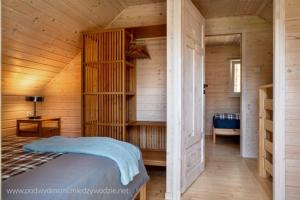 Katil atau katil-katil dalam bilik di Domki Pod Wydmami