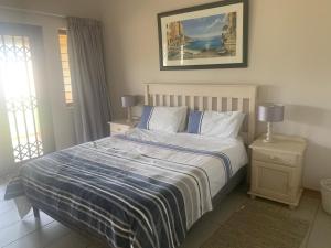 Ένα ή περισσότερα κρεβάτια σε δωμάτιο στο Holiday unit 37 Eden dunes +16 φωτογραφίες