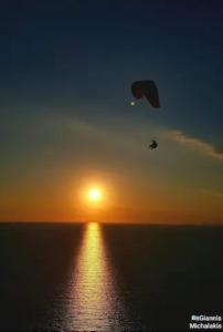 The sunrise or sunset as seen from a vendégházakat or nearby