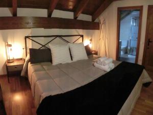 Tempat tidur dalam kamar di Ca Solleta, casa de montaña a 20 min de la Peülla, Vaqueira-Beret