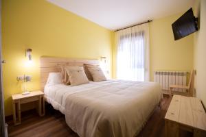 A bed or beds in a room at La Casona de Cardes