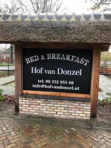 a sign for a hot van drowel in a park at Hof van donzel in Nistelrode