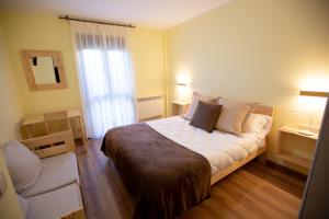 A bed or beds in a room at La Casona de Cardes