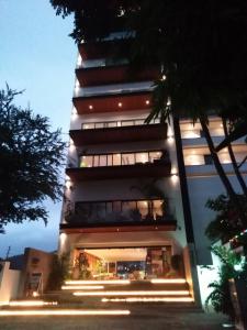 a tall building with stairs leading up to it at night at SAIL VIEW 105 VALLARTA, Ocean View in Puerto Vallarta