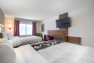 Кровать или кровати в номере La Quinta by Wyndham Mobile +34 фотографии