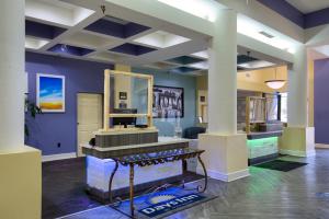 a salon with a mirror and a dressing room at Days Inn by Wyndham Mobile I-65 in Mobile