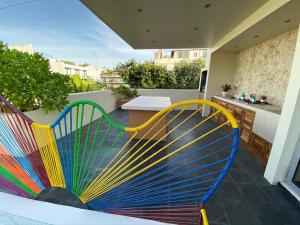 a colorful bench on the balcony of a house at Casarte Boutique Hotel in Playa del Carmen