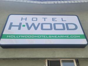 a sign for a hotelwwaldoglothemiaemiaemiaemiaemiaemiaemia at Hotel H-Wood in Los Angeles