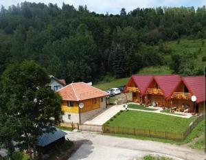 an aerial view of a house with red roofs at Drveni raj Uvac in Sjenica