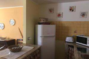 A kitchen or kitchenette at Appartamento accogliente