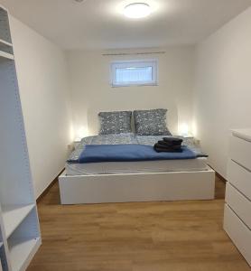 Postel nebo postele na pokoji v ubytování Am Borgwallsee 2
