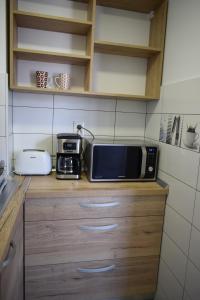 Kuchyň nebo kuchyňský kout v ubytování Apartament Palatul de Justitie RHBM