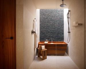 a bathroom with a sink and a window at Nobu Hotel Los Cabos in Cabo San Lucas