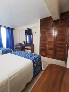 Katil atau katil-katil dalam bilik di Habitaciones del Pacifico