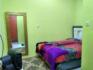 Postel nebo postele na pokoji v ubytování Hotel Alifah 2 + 12 fotografií