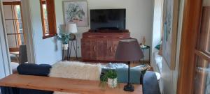
A television and/or entertainment center at At Home Apartments
