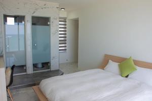 Postel nebo postele na pokoji v ubytování BEACH FRONT VILLA