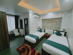 Postel nebo postele na pokoji v ubytování Chautari Boutique Hotel