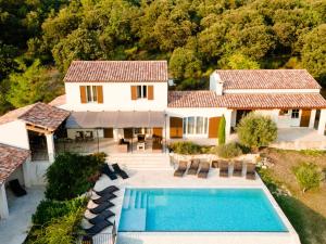 an aerial view of a house with a swimming pool at Luxury villa in Provence with a private pool in Martres-Tolosane