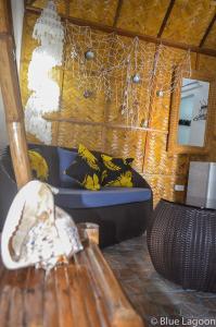 a room with a couch with bananas on it at Blue Lagoon Dive Resort in Sabang