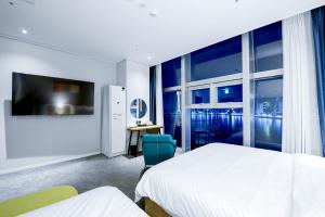 TV a/nebo společenská místnost v ubytování Ocean The Point Hotel Busan