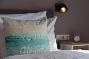 Letto o letti in una camera di AKZENT Strandhotels Seestern, Delphin & Lachs