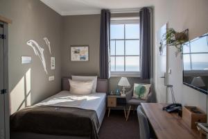 Letto o letti in una camera di AKZENT Strandhotels Seestern, Delphin & Lachs